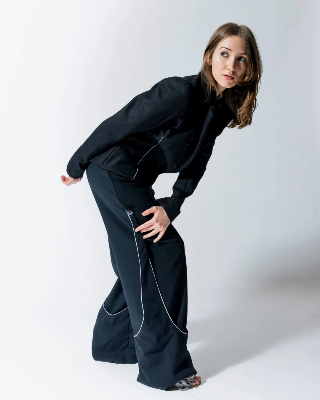 Trace Suit leaning